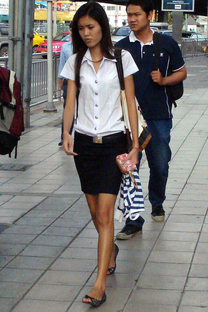 Students in school uniforms walking outside
