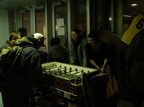 Students playing foosball in common room